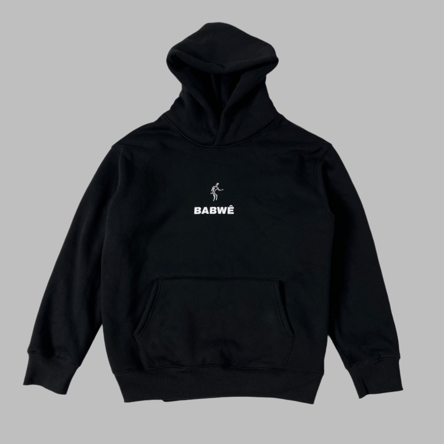 Front view of a black hoodie by Babwê, representing Zimbabwean streetwear culture, with bold African-inspired designs.